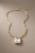 Emerald-cut clear crystal bezel pendant on a gold paperclip chain